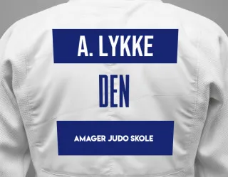Judo GI with a backnumber showing the name Aksel Damgaard Lykke from Amager Judo Skole