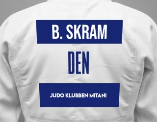 Judo GI with a backnumber showing the name Bjørk Elna Friis Skram from Judo Klubben Mitani