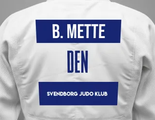 Judo GI with a backnumber showing the name Buus Mette from Svendborg Judo Klub