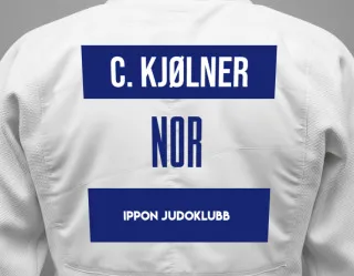Judo GI with a backnumber showing the name Caspian Kjølner from Ippon Judoklubb