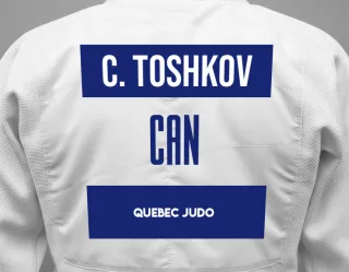 Judo GI with a backnumber showing the name Catherine Toshkov from Quebec Judo
