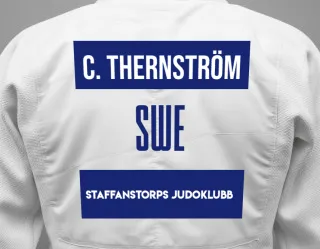 Judo GI with a backnumber showing the name Charlie Thernström from Staffanstorps Judoklubb