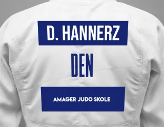 Judo GI with a backnumber showing the name Damien Hannerz from Amager Judo Skole