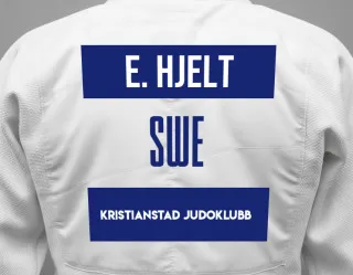 Judo GI with a backnumber showing the name Evelina Hjelt from Kristianstad Judoklubb