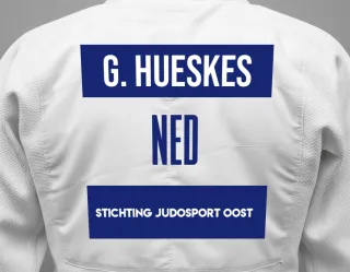 Judo GI with a backnumber showing the name Giel Hueskes from Stichting Judosport Oost