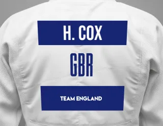 Judo GI with a backnumber showing the name Harry Cox from Team England