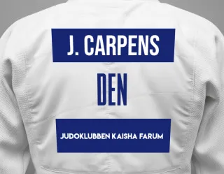 Judo GI with a backnumber showing the name Julie Carpens from Judoklubben Kaisha Farum