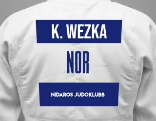 Judo GI with a backnumber showing the name Kinga Wezka from Nidaros judoklubb