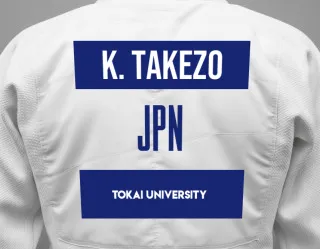 Judo GI with a backnumber showing the name Kishi Takezo from Tokai University