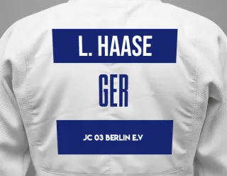 Judo GI with a backnumber showing the name Lotte Haase from JC 03 Berlin e.V