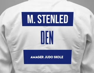 Judo GI with a backnumber showing the name Mads Stimpel Stenled from Amager Judo Skole