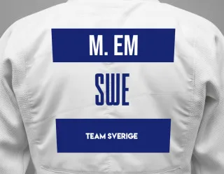 Judo GI with a backnumber showing the name Maksim Em from Team Sverige
