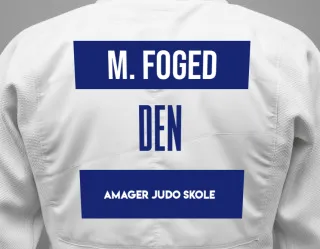 Judo GI with a backnumber showing the name Malte Köppe Foged from Amager Judo Skole