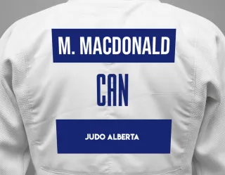 Judo GI with a backnumber showing the name Meadow Taylor Macdonald from Judo Alberta