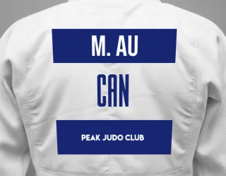 Judo GI with a backnumber showing the name Megan Au from Peak Judo Club