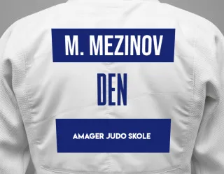 Judo GI with a backnumber showing the name Mikhail Mezinov from Amager Judo Skole