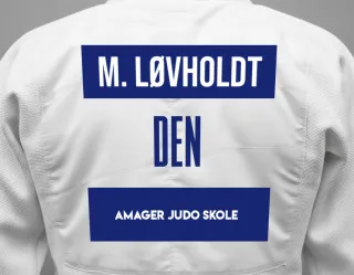 Judo GI with a backnumber showing the name Mikkel Løvholdt from Amager Judo Skole