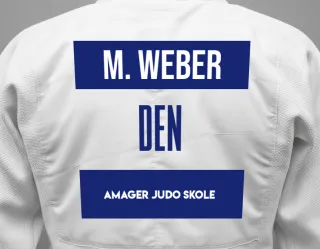 Judo GI with a backnumber showing the name Mikkel Weber from Amager Judo Skole