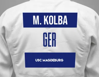 Judo GI with a backnumber showing the name Milla Kolba from USC Magdeburg