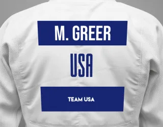 Judo GI with a backnumber showing the name Mitchell Greer from Team USA