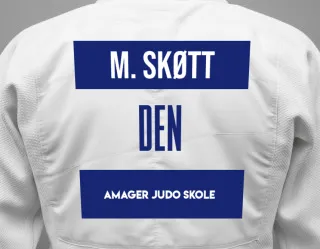 Judo GI with a backnumber showing the name Molly Auora Krüger Skøtt from Amager Judo Skole