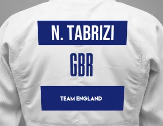 Judo GI with a backnumber showing the name Niusha Tabrizi from Team England