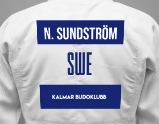 Judo GI with a backnumber showing the name Noa Sundström from Kalmar Budoklubb