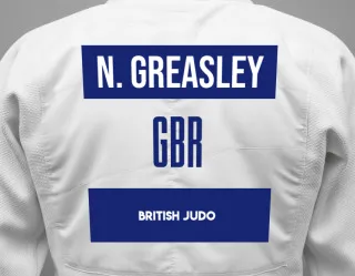 Judo GI with a backnumber showing the name Nye Greasley from British Judo