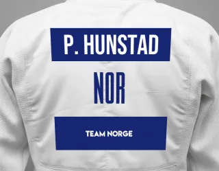 Judo GI with a backnumber showing the name Peter Hunstad from Team Norge