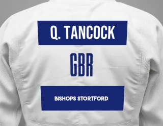 Judo GI with a backnumber showing the name Queenie Tancock from Bishops Stortford
