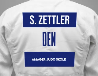 Judo GI with a backnumber showing the name Simon Nam Zettler from Amager Judo Skole