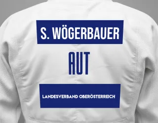 Judo GI with a backnumber showing the name Simon Wögerbauer from Landesverband Oberösterreich