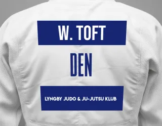 Judo GI with a backnumber showing the name William Ramlow Toft from Lyngby Judo & Ju-Jutsu Klub